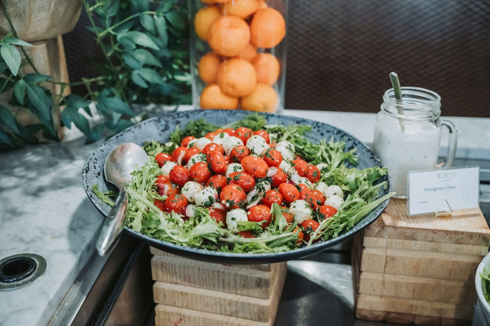 Caprese salad with cherry tomatoes, mozzarella, and arugula