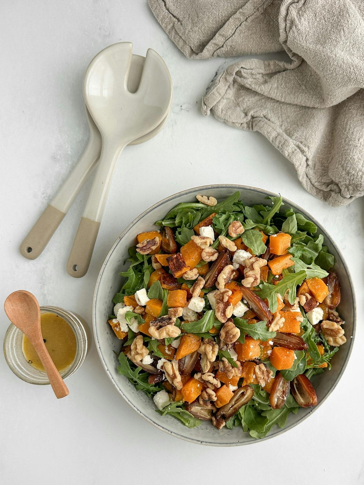Arugula salad with roasted squash and walnuts